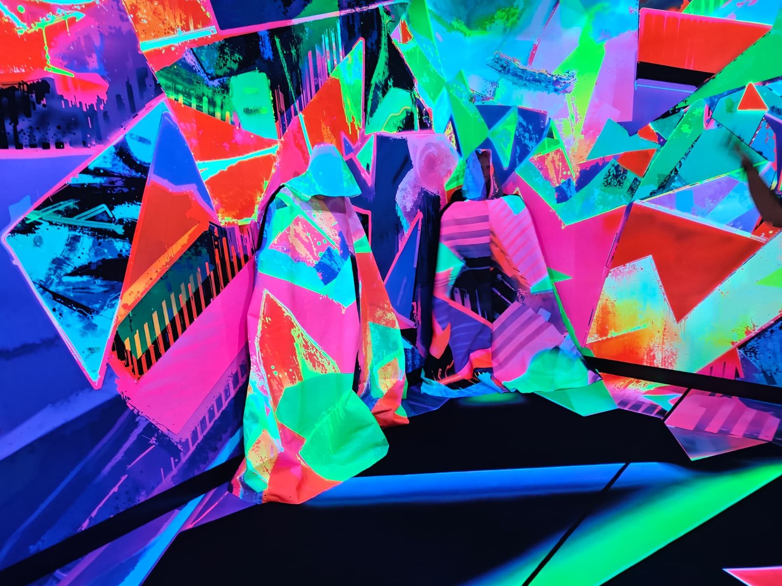 Fluorescent art installation with vivid geometric surfaces